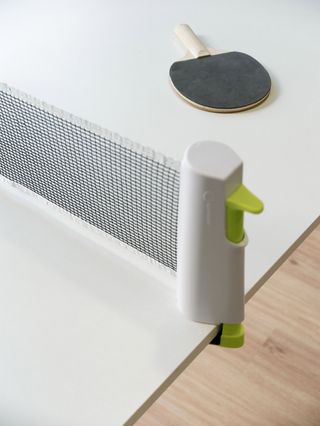 Membros xogando ao ping-pong na área de relax de Modular
